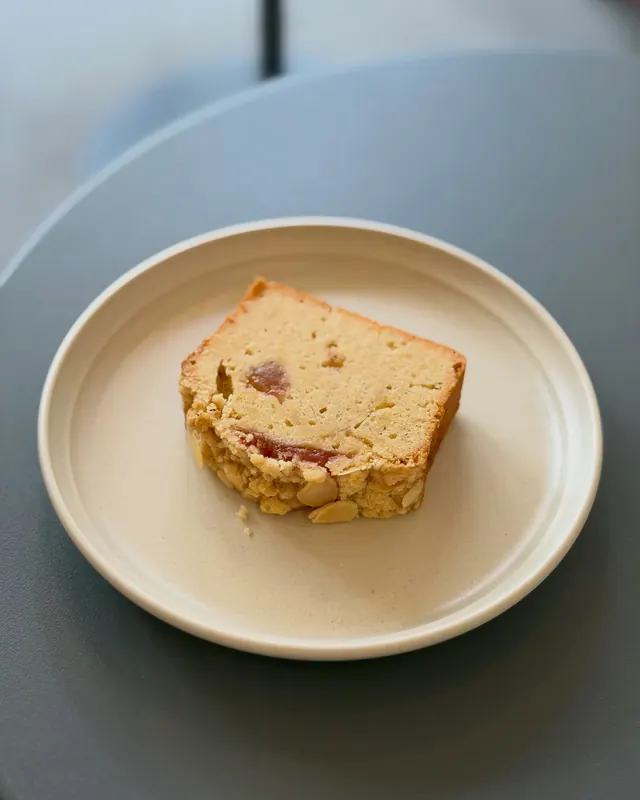 A bake made with fig jam on an off-white plate