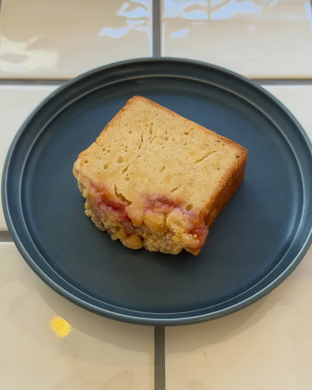 Plum jam pound cake on a blue-gray plate